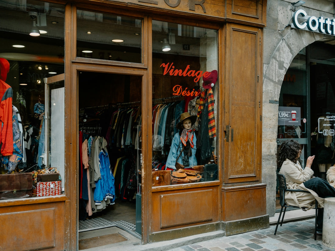 Vintage clothing store with items displayed in window